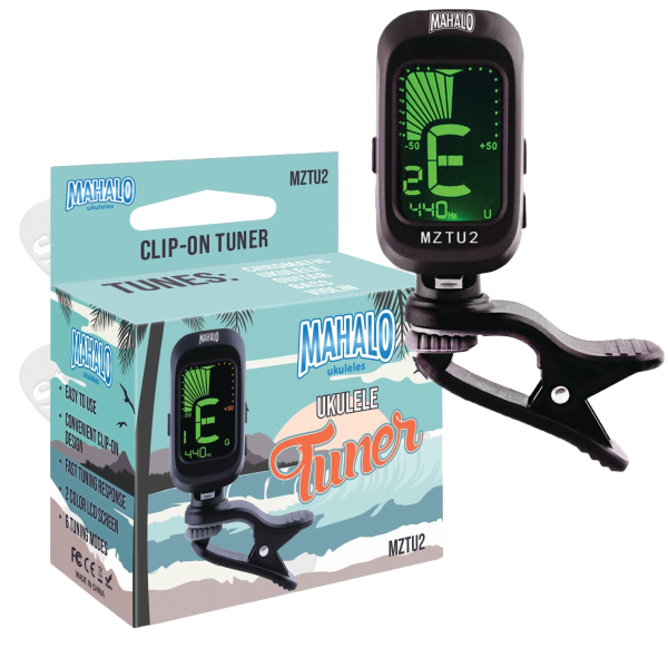 A black digital clip-on tuner displaying a green screen next to its retail display box, which features printed illustrations of waves and a palm tree.