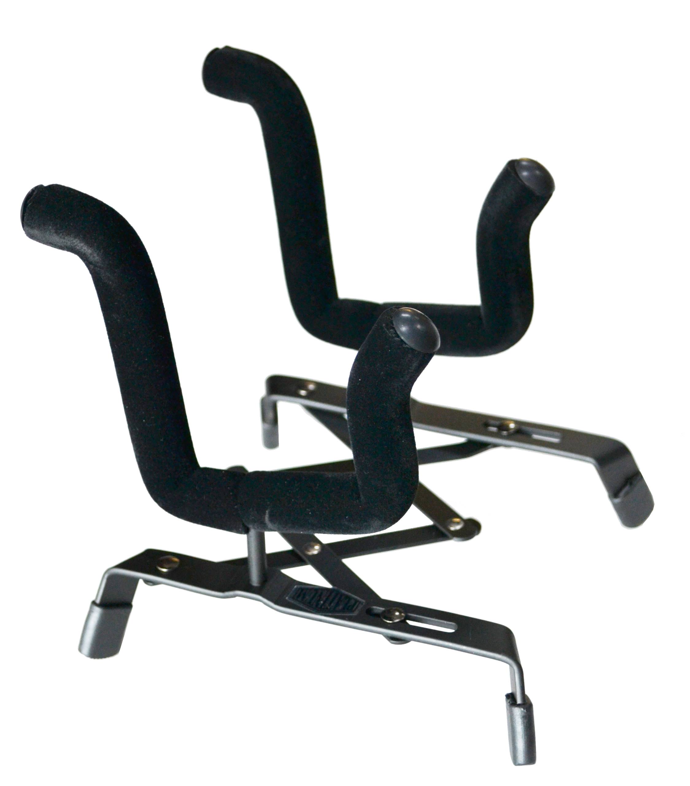 A black metal concertina-style instrument stand resting on four rubber feet, featuring two wide, U-shaped support arms heavily wrapped in black protective material.