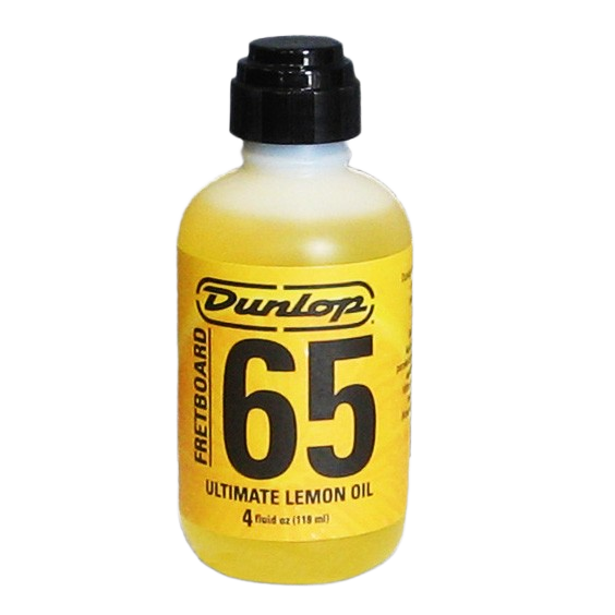 A clear 4 fluid ounce bottle filled with yellow liquid, featuring a black dispensing cap and a yellow label with black text reading Dunlop Fretboard 65 Ultimate Lemon Oil.