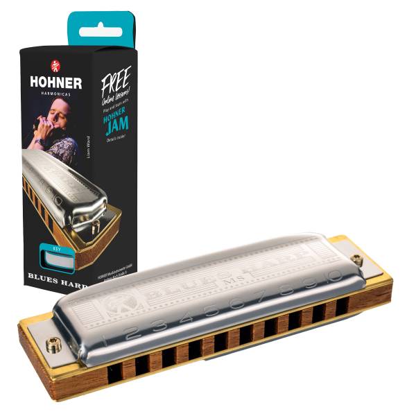 A Hohner Blues Harp MS harmonica positioned next to its black retail box, which features a photograph of a musician playing a harmonica.