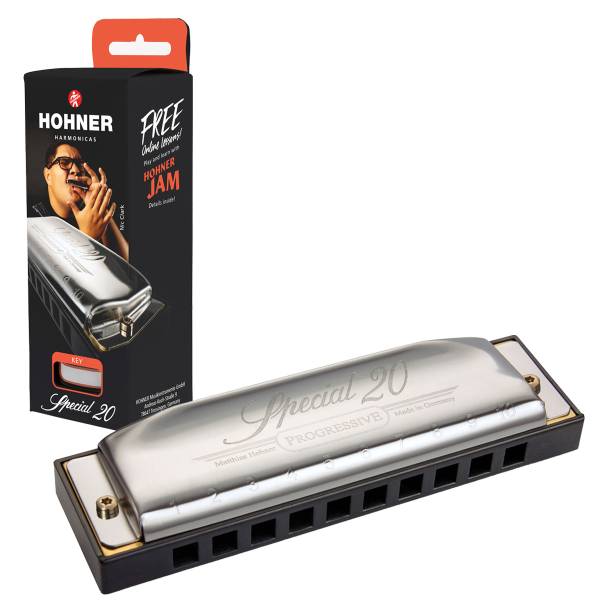 A silver Hohner Special 20 Progressive harmonica with a black plastic comb, placed next to its vertical black retail box featuring a portrait of Nic Clark and a free online lessons offer.