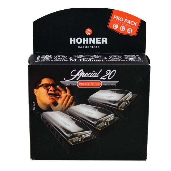 A black Hohner retail display box featuring a portrait of Nic Clark, displaying graphics of three Special 20 Progressive harmonicas and a callout highlighting the keys of C, G, and A.