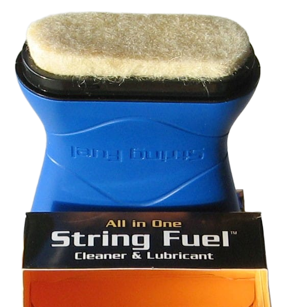 Music Nomad String Fuel applicator pad resting on top of its black and orange retail box.