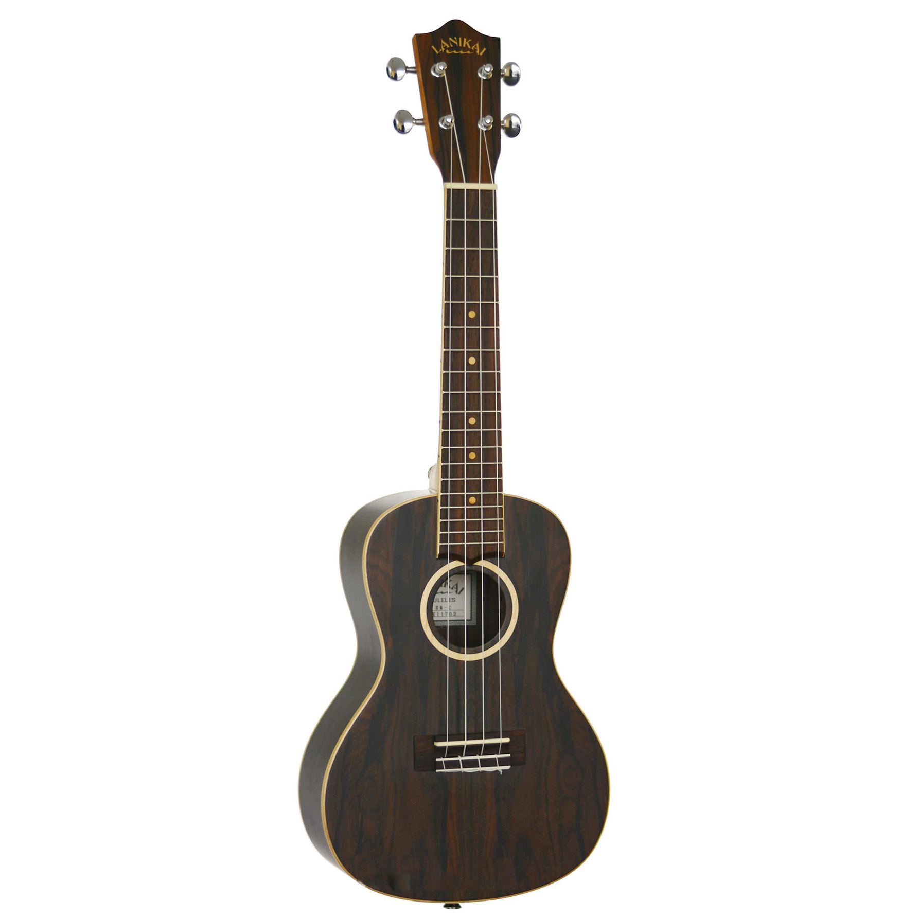 An angled view of a dark Ziricote wood concert ukulele featuring a distinctive contrasting wood grain pattern.