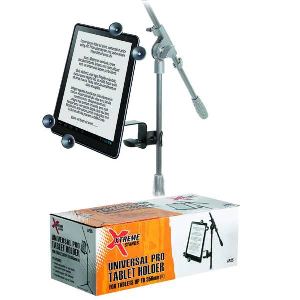 A tablet clamped to a microphone stand above the orange and white retail display box for the Xtreme Stands AP25 Universal Pro Tablet Holder, which displays printed illustrations of the product.