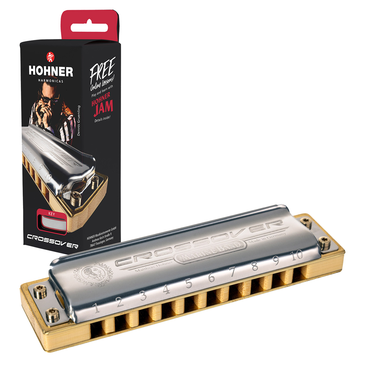 A silver Hohner Marine Band Crossover harmonica with a bamboo comb, positioned diagonally next to its vertical black retail display box featuring a portrait of Dennis Gruenling and a free online lessons promotion.