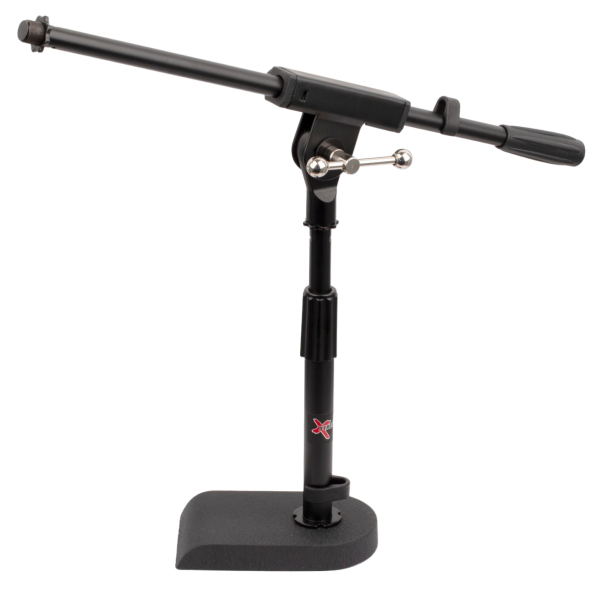Short black microphone boom stand featuring a solid, heavy cast base with a flat back edge, an upright pole with a red Xtreme logo sticker, and an adjustable boom arm.