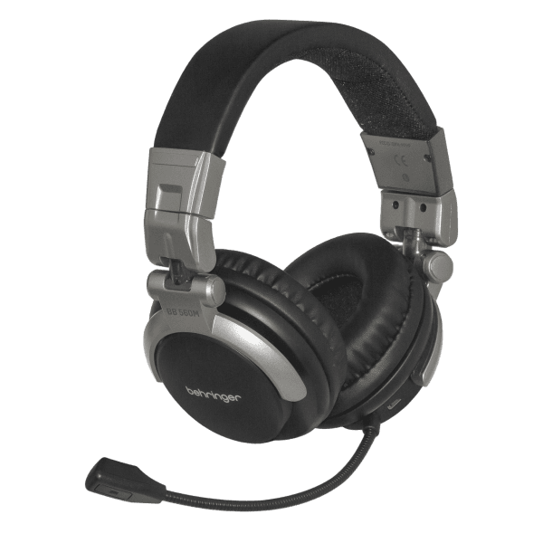 A pair of black over-ear Behringer wireless headphones with an attached boom microphone on the earcup.
