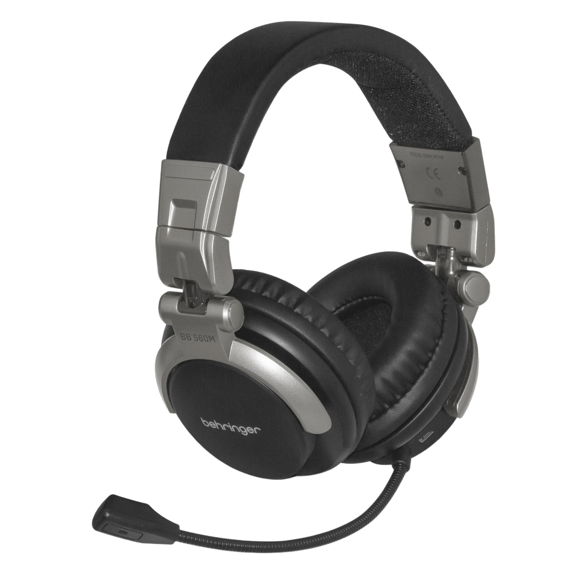 A pair of black over-ear Behringer wireless headphones with an attached boom microphone on the earcup.