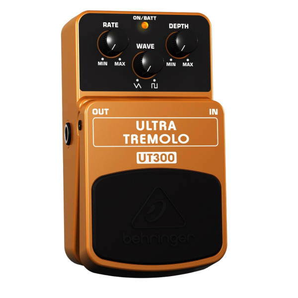 A yellow Behringer UT300 Ultra Tremolo effects pedal viewed from above, showing three control knobs and a black footswitch.