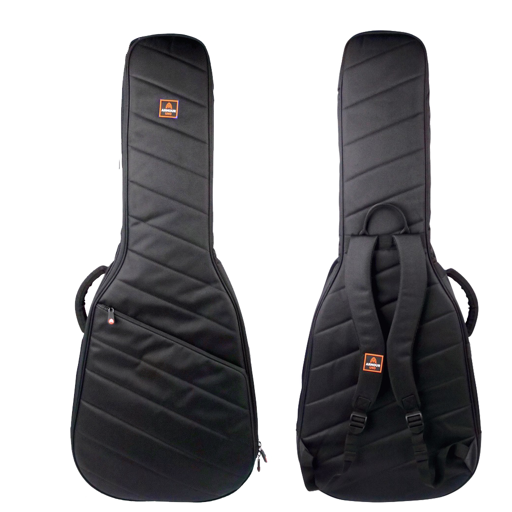 Front and back views of a black padded acoustic guitar gig bag with diagonal stitching, an orange Armour Uno logo, a front pocket, and adjustable backpack straps.