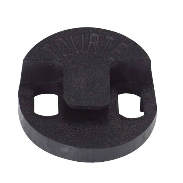 A close-up of a circular black rubber Tourte violin mute featuring two cut-out holes, a central mounting clip, and the word TOURTE molded into the top surface.