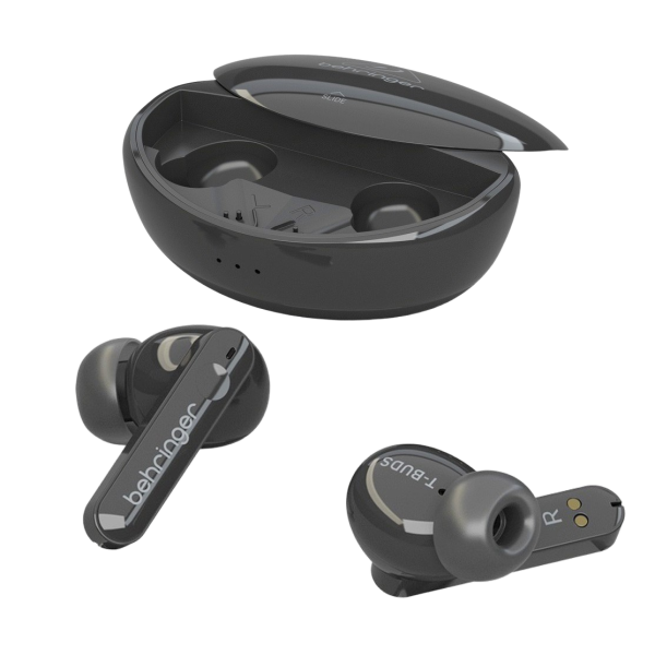 Two black Behringer T-Buds wireless earbuds displayed on a white surface next to an open, empty black charging case and three pairs of replacement silicone ear tips.