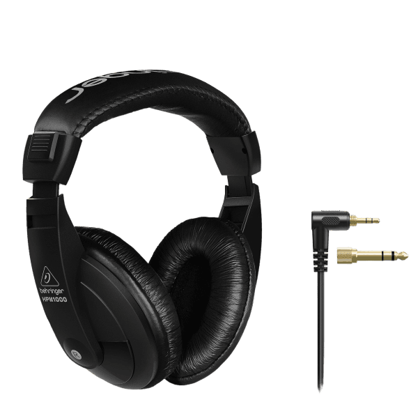 A pair of black Behringer HPM1000-BK over-ear headphones with an attached cable ending in a quarter-inch adapter plug.