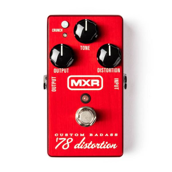 Top-down view of a red brushed metal MXR Custom Badass '78 distortion pedal with three black knobs, a small crunch button, and a silver footswitch.