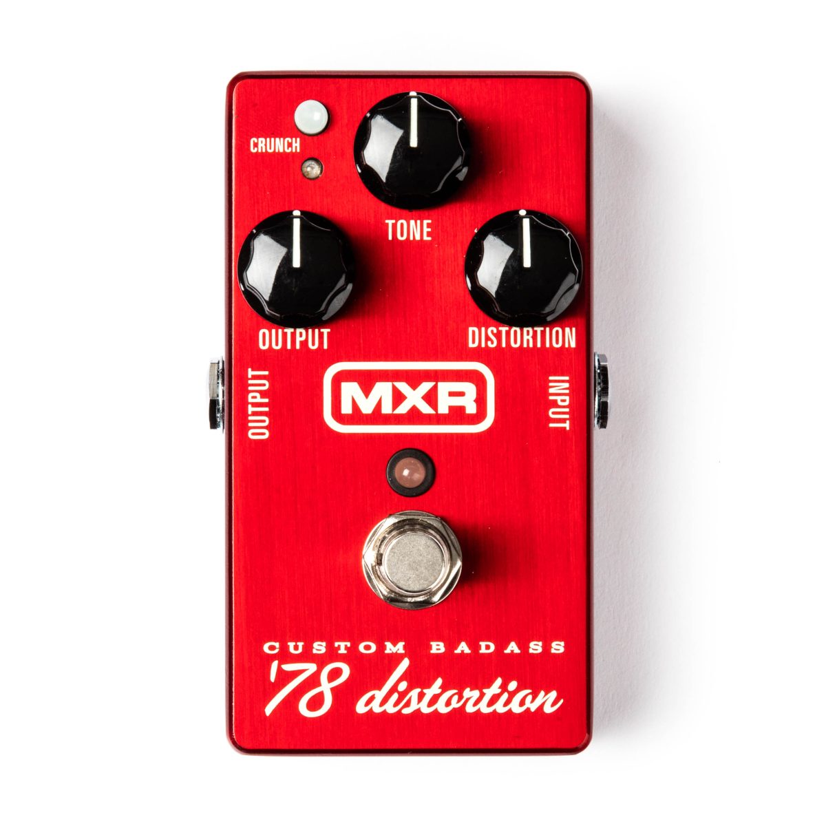 Top-down view of a red brushed metal MXR Custom Badass '78 distortion pedal with three black knobs, a small crunch button, and a silver footswitch.