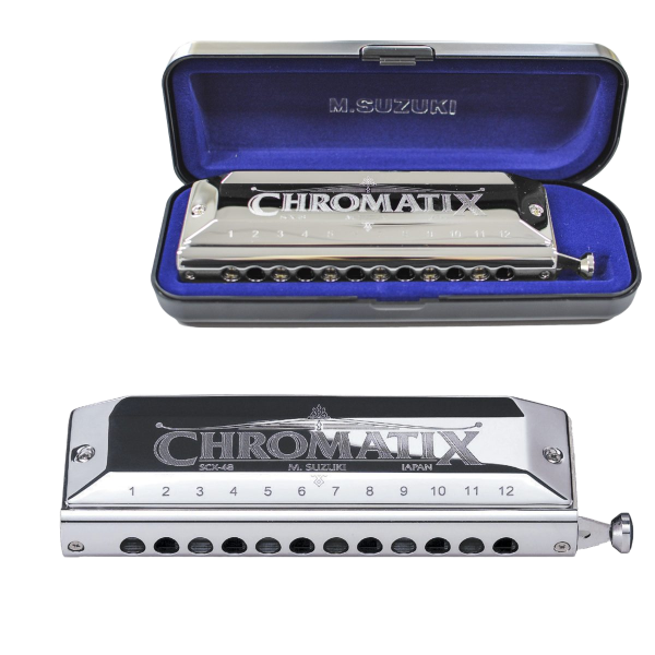 A silver Suzuki Chromatix SCX-48 harmonica displayed next to its open, blue velvet-lined hardshell carrying case.