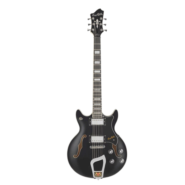 A black semi-hollow body electric guitar featuring a double cutaway, two f-holes, a black pickguard, dual humbucking pickups, block fretboard inlays, and an ornate silver trapeze tailpiece .
