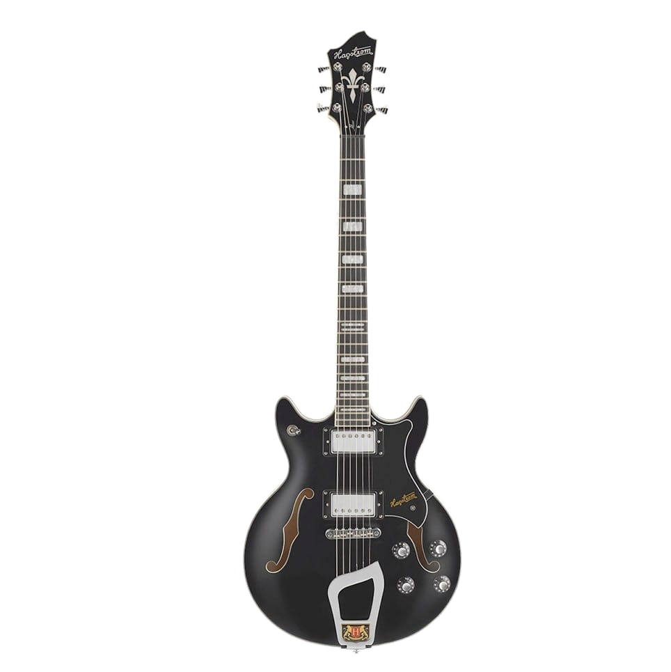 A black semi-hollow body electric guitar featuring a double cutaway, two f-holes, a black pickguard, dual humbucking pickups, block fretboard inlays, and an ornate silver trapeze tailpiece .
