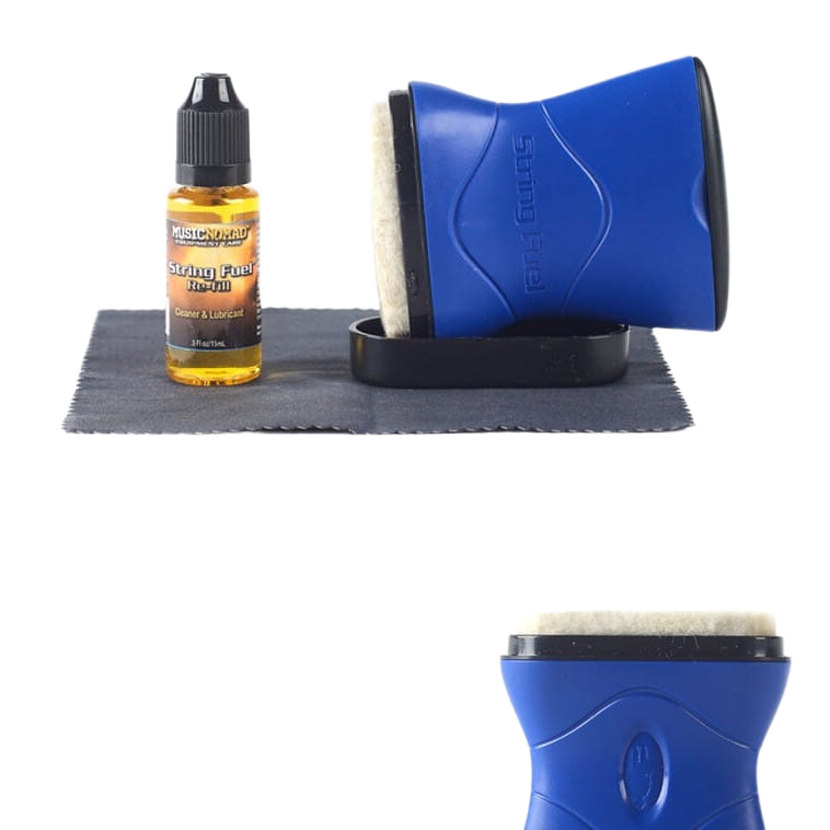 A clear bottle of Music Nomad String Fuel liquid with a black dropper cap sits beside a folded dark grey microfiber cloth. Next to the cloth is a blue ergonomic applicator tool with a white felt pad resting on its black plastic base. Below the main configuration is a secondary inset showing a close-up angle of the blue applicator's top edge and white felt pad.