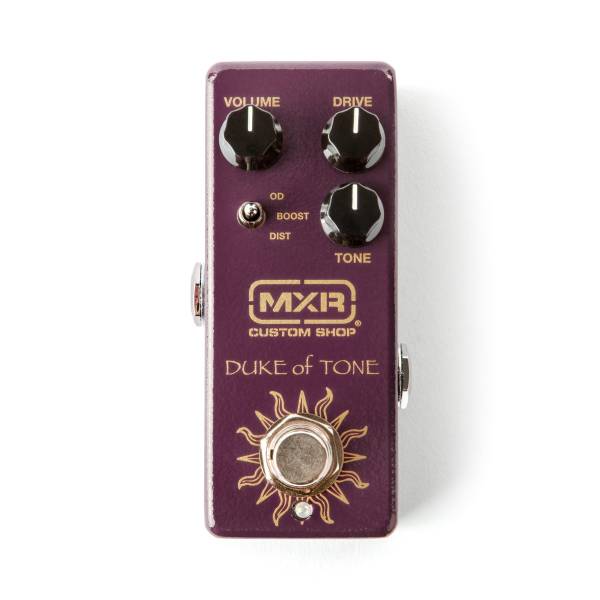 Top-down view of a deep purple MXR Custom Shop Duke of Tone pedal featuring three black knobs, an OD/Boost/Dist switch, and a gold sun graphic around the footswitch.