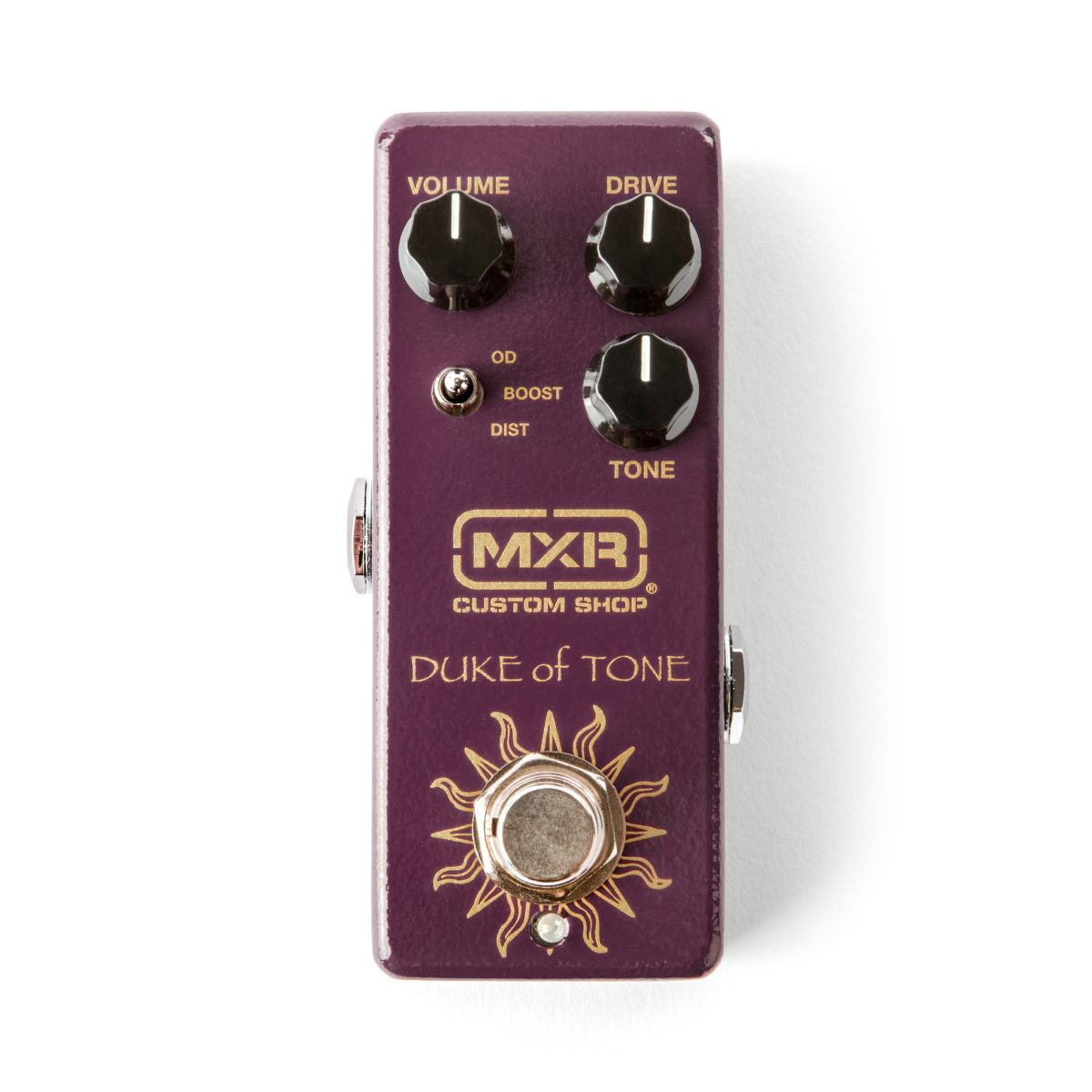 Top-down view of a deep purple MXR Custom Shop Duke of Tone pedal featuring three black knobs, an OD/Boost/Dist switch, and a gold sun graphic around the footswitch.
