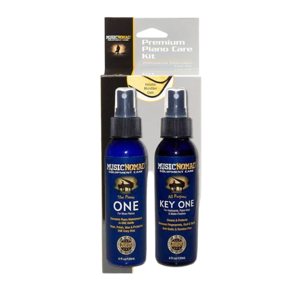 Music Nomad Premium Piano Care Kit retail display box holding two spray bottles, featuring printed text on the packaging that indicates an included microfiber cloth.