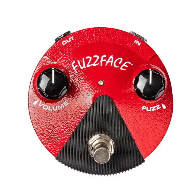 Top-down view of a red, round Dunlop Fuzz Face Mini pedal with a textured finish, featuring two black knobs for Volume and Fuzz, and a silver footswitch.