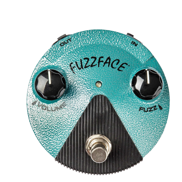 Top-down view of a turquoise, round Dunlop Fuzz Face Mini pedal with a hammered finish, featuring two black knobs for Volume and Fuzz, and a silver footswitch.