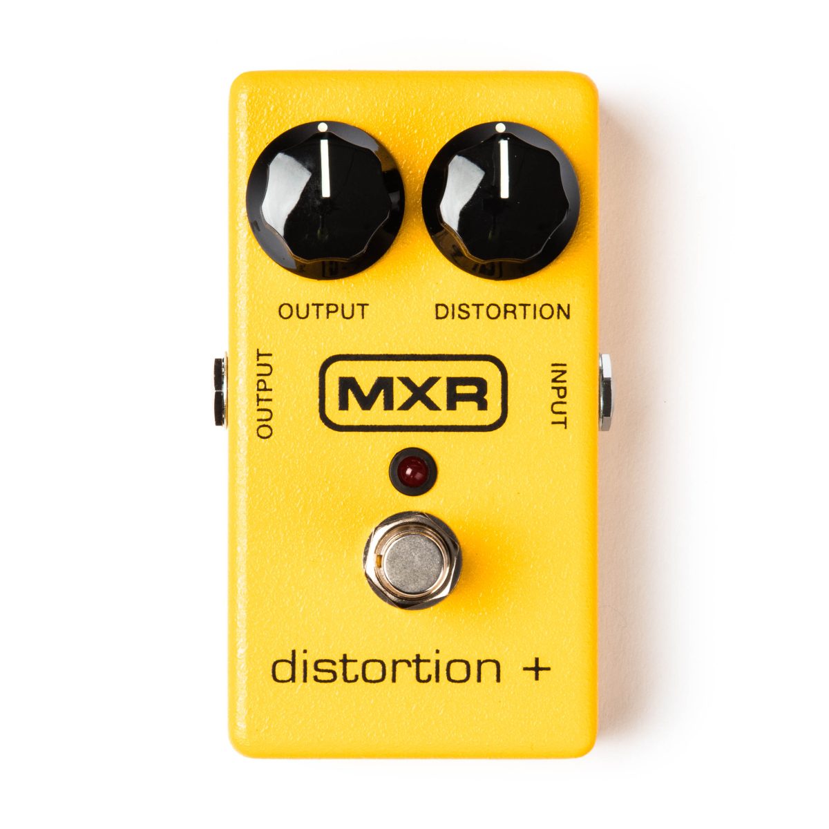 A rectangular yellow guitar effects pedal with two black knobs labeled output and distortion, a red LED light, a silver footswitch, and a black MXR logo.