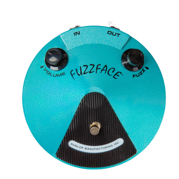 Top-down view of a large turquoise, round Dunlop Fuzz Face pedal with a hammered finish. It features two black knobs for Volume and Fuzz, a silver footswitch, and "DUNLOP MANUFACTURING INC." text on the bottom curve.