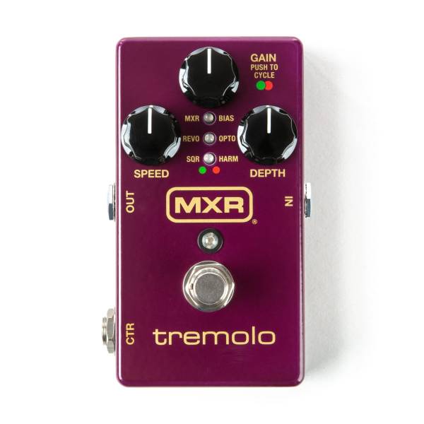 A purple MXR Tremolo pedal with Speed, Gain, and Depth knobs, accompanied by six LED indicators for different waveform modes and a silver footswitch.