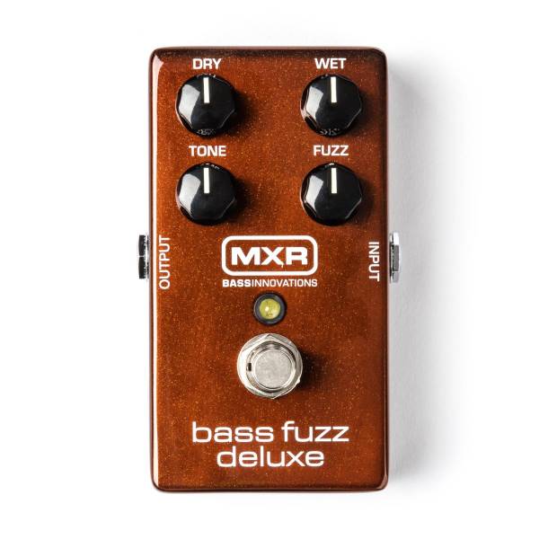 Top-down view of a metallic brown MXR Bass Fuzz Deluxe pedal with four black knobs labeled Dry, Wet, Tone, and Fuzz, and a single silver footswitch.
