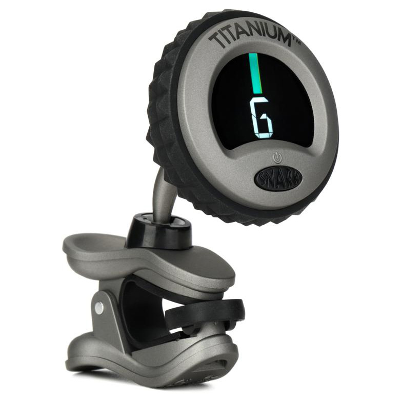 Grey Snark WST8T titanium chromatic clip-on tuner with a textured black rubber edge, displaying a G note on a bright digital screen.