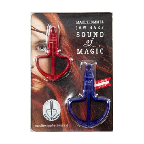 A retail blister pack card displaying two metal jaw harps, one red and one blue, mounted securely against a graphic background featuring a woman's face.