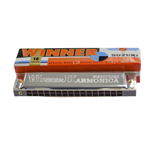 A silver tremolo harmonica with a black comb, displaying 16 square holes, placed in front of an orange, white, and blue cardboard box.