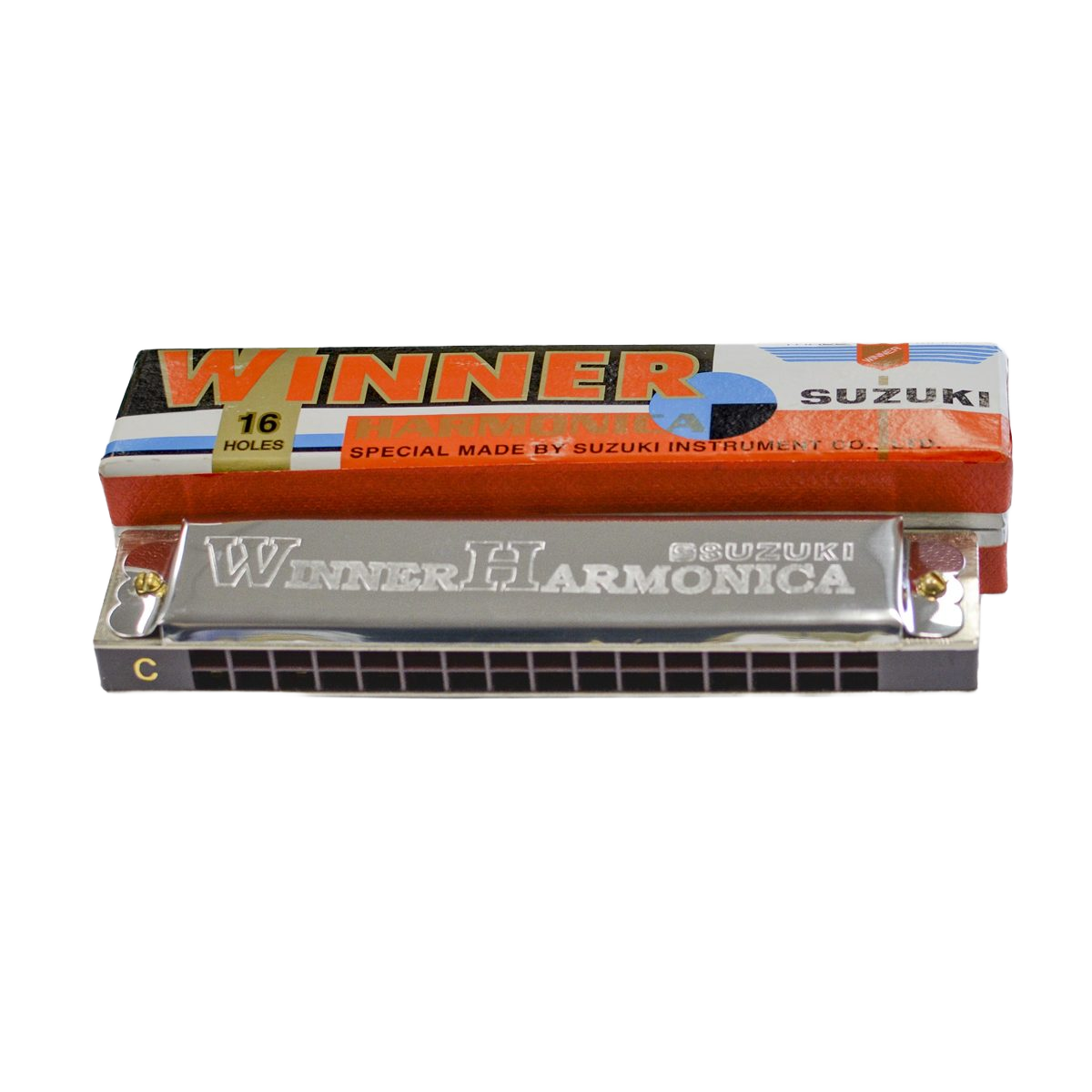 A silver tremolo harmonica with a black comb, displaying 16 square holes, placed in front of an orange, white, and blue cardboard box.