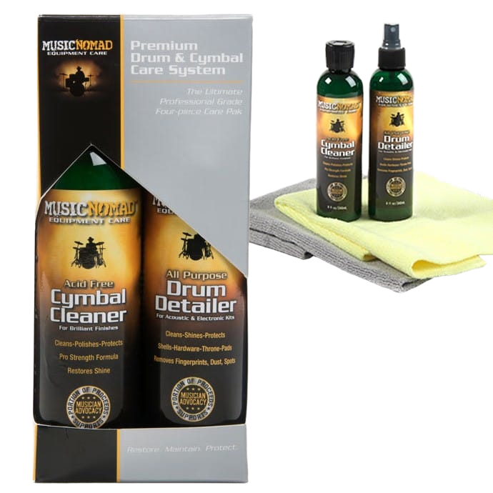 Music Nomad drum care retail box alongside a cymbal cleaner bottle, drum detailer bottle, and two folded, physical microfiber cloths resting outside the packaging.