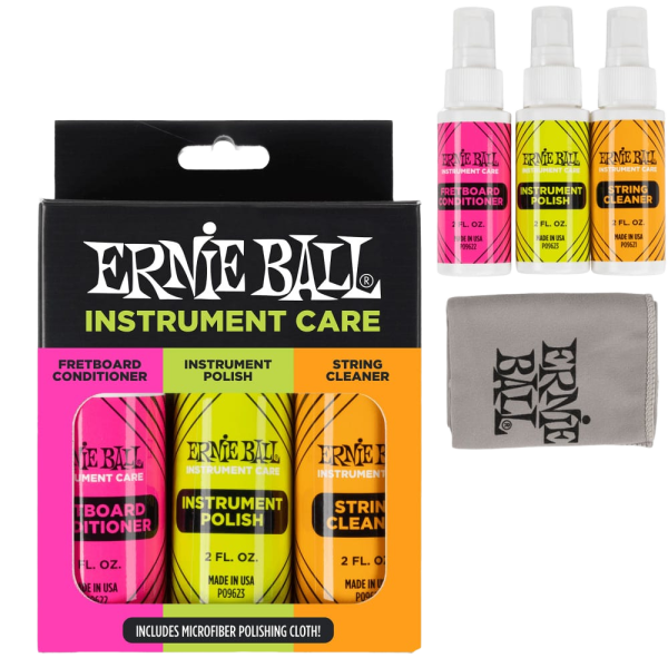 A black retail box for the Ernie Ball Instrument Care set alongside three physical spray bottles in pink, yellow, and orange, plus a grey physical microfiber cloth.