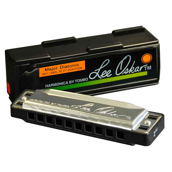 A Lee Oskar Major Diatonic harmonica with silver cover plates resting against its black interlocking plastic case featuring an orange label.