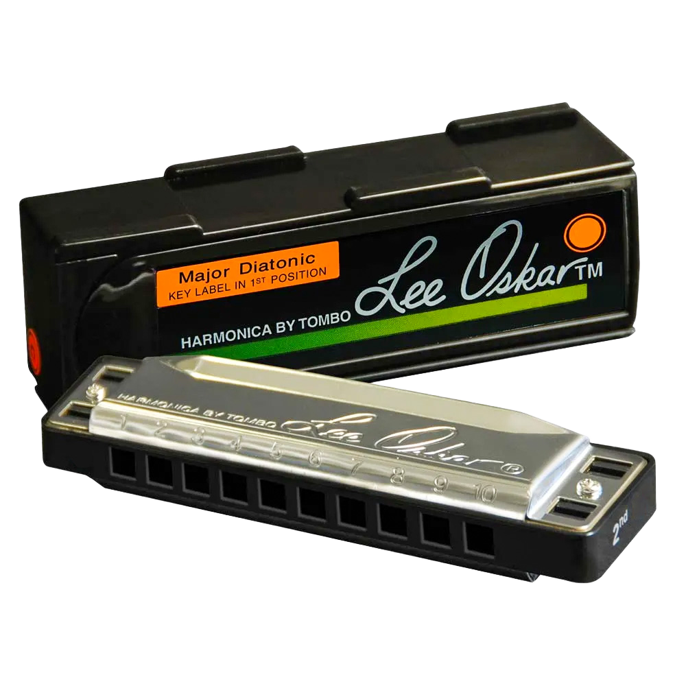 A Lee Oskar Major Diatonic harmonica with silver cover plates resting against its black interlocking plastic case featuring an orange label.