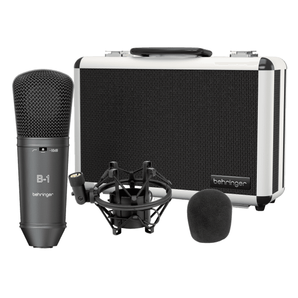The Behringer B-1 Dark Edition microphone in a dark grey finish, displayed alongside a black shock mount, a black foam windscreen, and a silver and black carrying case.