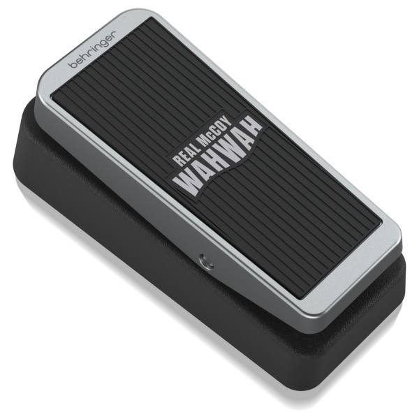 WAHWAH_1.jpg showing a Behringer Real McCoy WahWah effects pedal from a high angle, featuring a silver rocker top, a black rubber treadle pad with white lettering, and a solid black base.