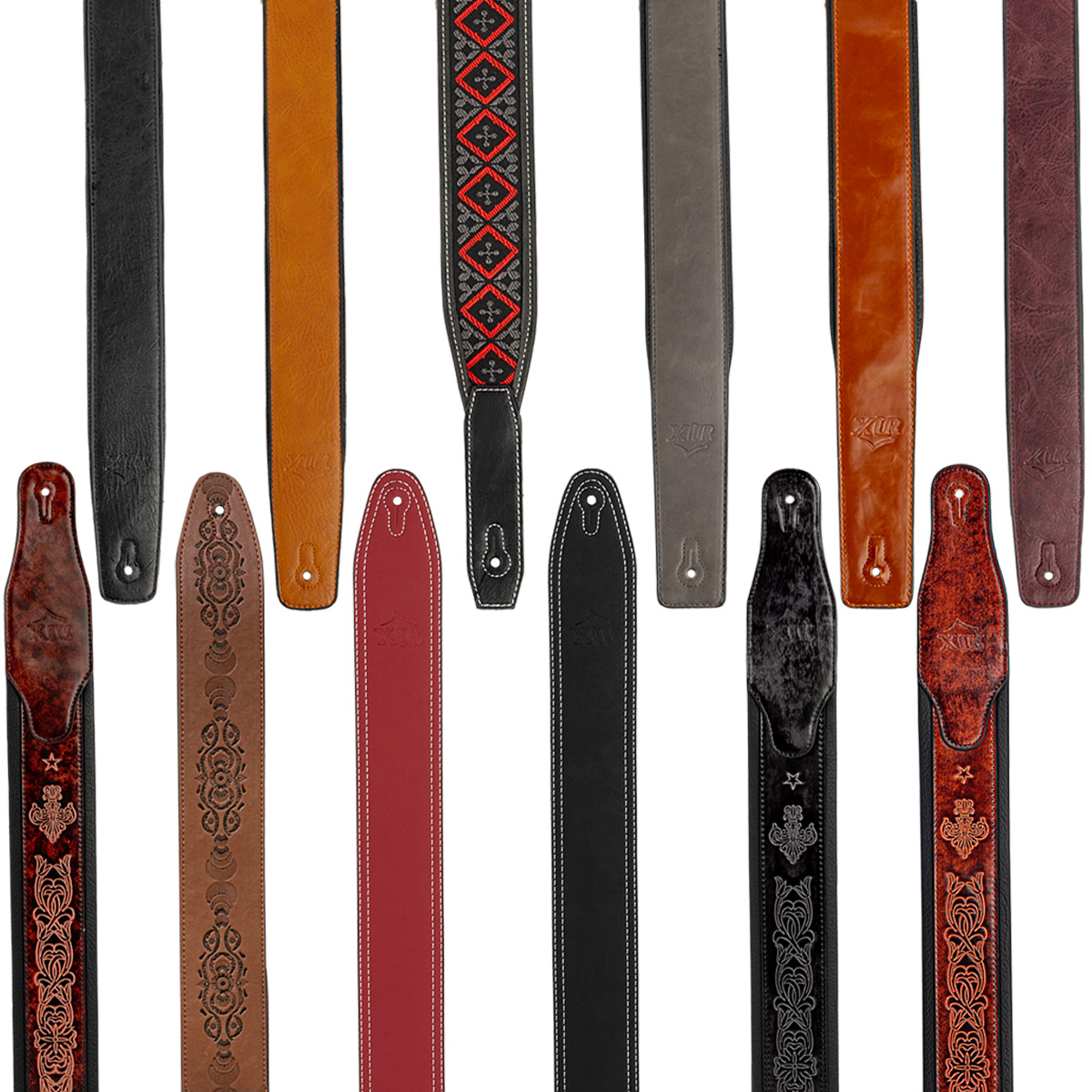 A collection of twelve XTR leather guitar straps arranged vertically, featuring various colors including black, brown, and red, with distinct finishes such as smooth, stitched, and intricately embossed patterns.